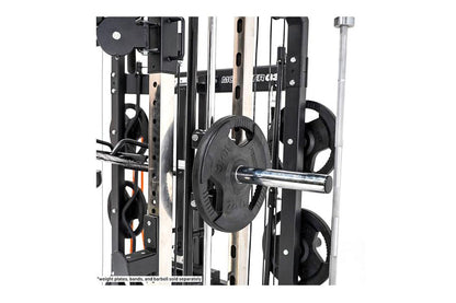 Black and silver multi-function gym machine with weight plates on chrome barbell, featuring cable crossover and smith machine