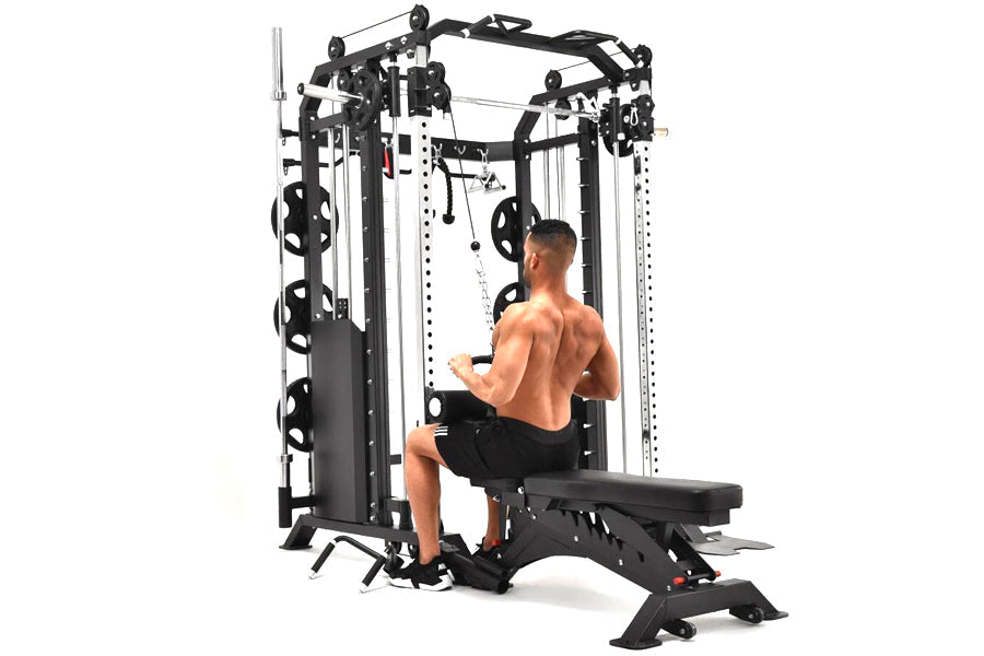 Black and white multi-station functional trainer with cable crossover system, Smith machine, and attached bench, shown with s