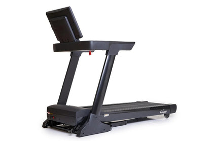 Black folding treadmill with digital display console, handrails, and running deck on white background