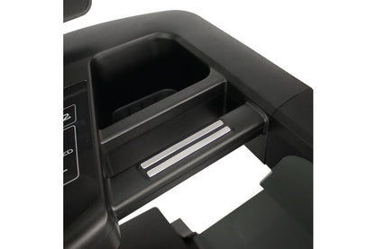 Black treadmill cup holder and storage compartment with chrome accents, open drawer detail