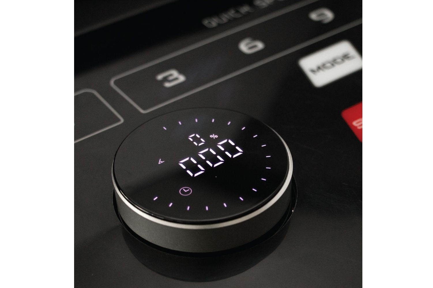 Round black digital timer with white LED display showing time, mounted on treadmill control panel with buttons and red emerge