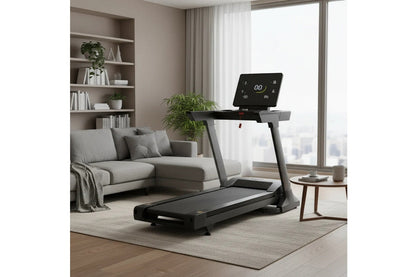 Black folding treadmill with digital display console in modern living room setting