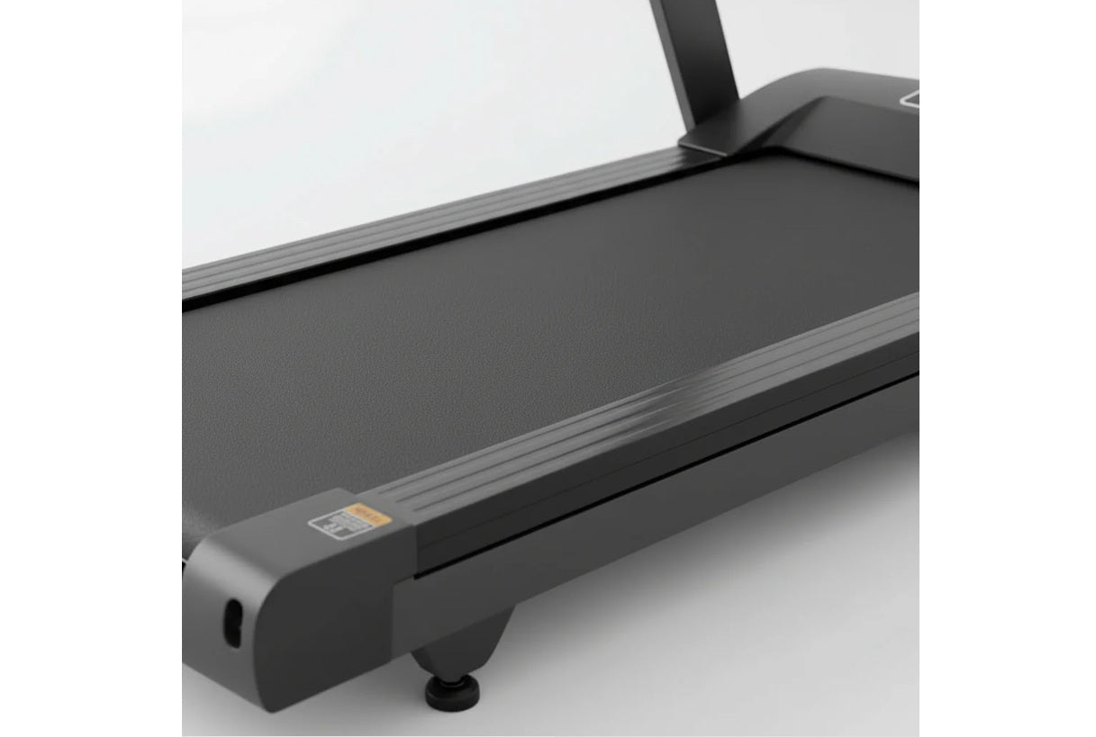 Black folding treadmill with gray running deck and digital control panel on white background