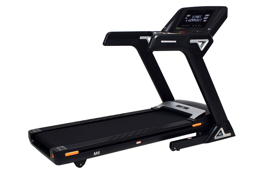 Black folding treadmill with digital touchscreen display, orange accents, and M6 model designation on white background