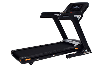 Black folding treadmill with digital touchscreen display, orange accents, and M6 model designation on white background