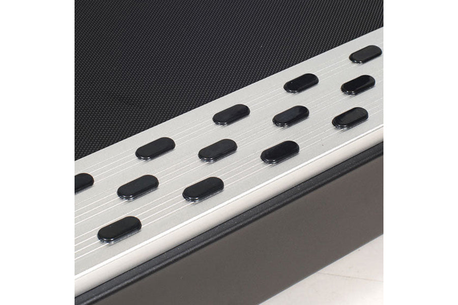 Silver running treadmill with black foot pedals and dark textured running surface, displayed at angle on white background