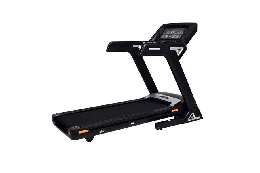 Black folding treadmill with digital touch console, orange accents, and wide running deck on white background