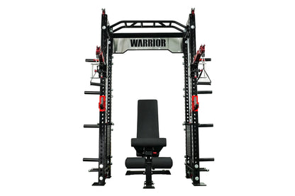 Warrior 2.0 black cable crossover power rack with red pulley system and attached black weight bench on white background