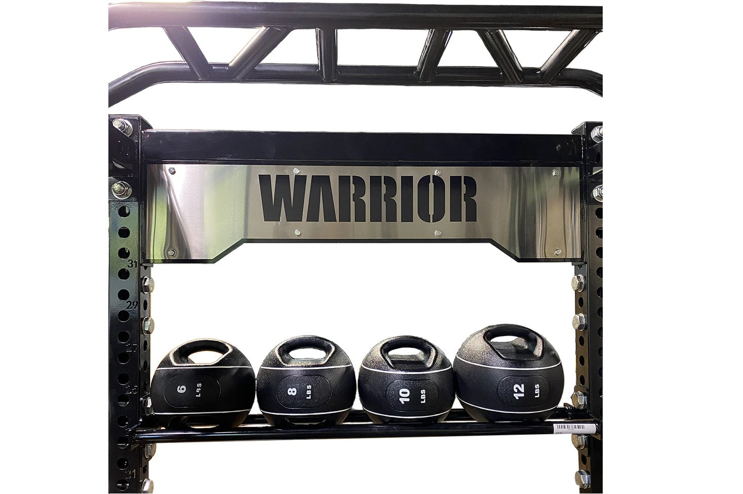 Warrior black and stainless steel cable crossover pulley power rack with four medicine balls displaying 6, 8, 10, and 12 lbs 
