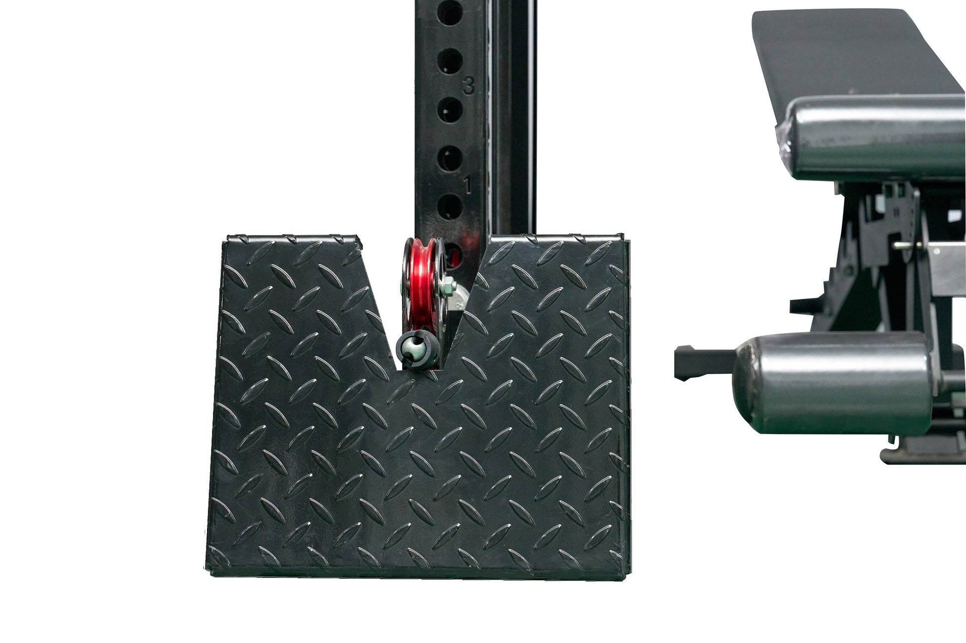 Black diamond plate cable crossover pulley system with red pulley wheel and metal machine components, on white background