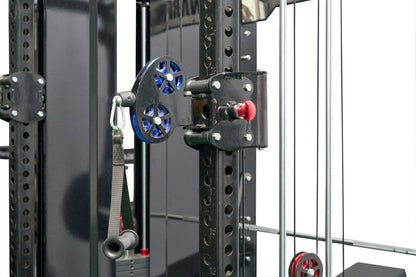 Black cable machine pulley system with blue and red wheels attached to metal power rack frame with adjustment holes