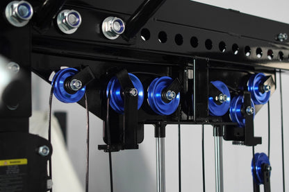 Black cable crossover machine with blue pulleys and metal frame, gym equipment detail view