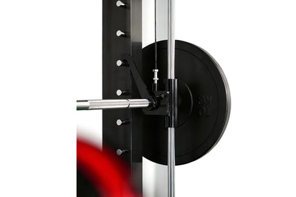 Warrior 3.5 cable crossover pulley power rack with black weight plate loaded on chrome barbell, shown from side angle