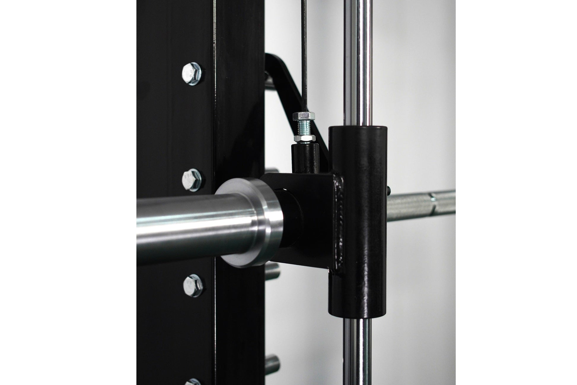 Black and chrome cable crossover pulley attachment with adjustable arm and metal hardware mounted on power rack frame