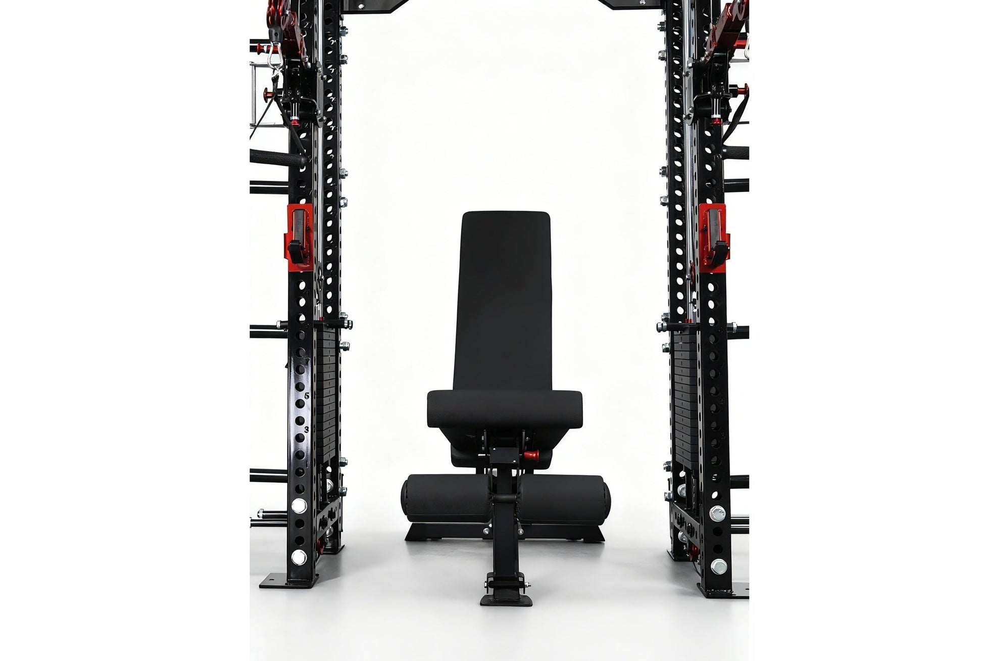 Black and red cable crossover power rack with dual weight stacks, lat pulldown station, and adjustable black weight bench pos