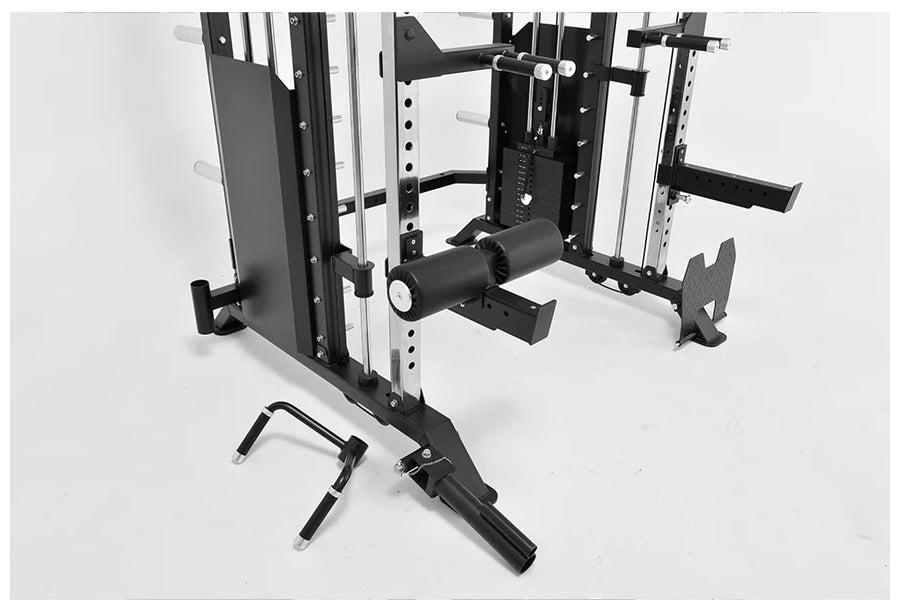 Black and white multi-station home gym with cable crossover, Smith machine, and functional trainer equipment on white backgro