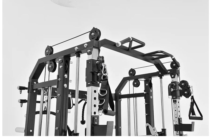 Black and white multi-station functional trainer with cable crossover system, pulleys, and adjustable weight stacks on white 