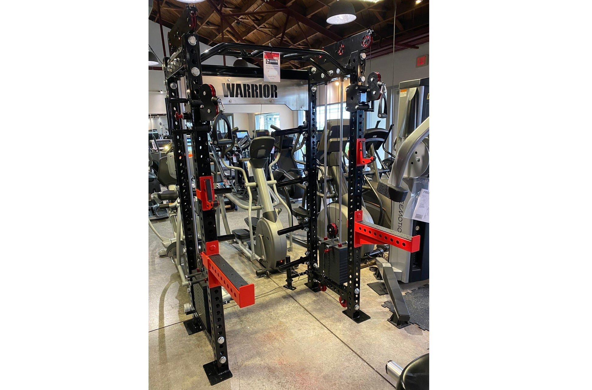 Warrior 2.0 black and red cable crossover pulley power rack with dual stations in gym showroom