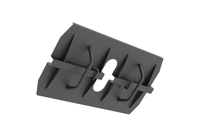 Dark gray plastic foot pedal attachment with multiple segmented slots and adjustment straps, isolated on white background